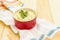 Warm mashed potatoes in a ceramic bowl with fresh parsley. On a vintage linen napkin on a stone background, copy space, close up