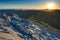 Warm morning sunlight bursting over the mountain peak