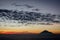 Warm morning sunrise on Ghober Hut campsite with view of mount Cikuray. Beautiful landscape of mount Papandayan. Papandayan