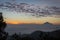 Warm morning sunrise on Ghober Hut campsite with view of mount Cikuray. Beautiful landscape of mount Papandayan. Papandayan