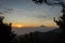 Warm morning sunrise on Ghober Hut campsite with view of mount Cikuray. Beautiful landscape of mount Papandayan. Papandayan
