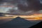 Warm morning sunrise on Tebing Soni with view of mount Cikuray. Beautiful landscape of mount Papandayan. Papandayan Mountain is