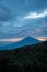 Warm morning sunrise on watch tower with view of mount Cikuray. Beautiful landscape of mount Papandayan. Papandayan Mountain is
