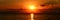 Warm orange sunset on sea horizontal line panorama