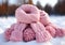 Warm pink wool scarf in the snow. Winter time. AI generated