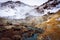 Warm river and mountains in snow in krysuvik seltun on reykjanes peninsula in Iceland winter landscape