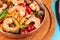 Warm salad of grilled fish pieces, shrimps and mussels in a frying pan