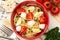 Warm salad with pasta, mozzarella and tomatoes.