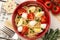 Warm salad with pasta, mozzarella and tomatoes.