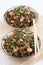 Warm sea cabbage salad with fried tofu, top view, vertical