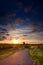 Warm summer sunrise and windmill