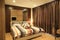 Warm tone of luxury interiors design of the bedroom in condominium, as background.