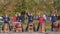 Warm up before the marathon. A group of drummers plays rhythmic music for the runners. Recreational sports activities for people