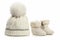 Warm woolen baby hat and booties over white