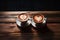 Warmth in a cup latte art forms a heart on wood