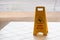 warning beware accident concept, The image of yellow caution wet floor plastic sign put on the concrete floor