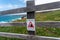 Warning cliff signs on a wooden fence