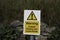 Warning coastal erosion and loose rocks sign