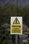 Warning coastal erosion and loose rocks sign