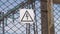 Warning of high voltage on the fence of the power plant. Danger of electric shock. Sign of danger. Electric substation
