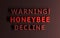 Warning message with red bold words Warning Honeybee Decline written in red bold letters on red background