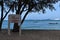 Warning no swimming sign with strong sea wave by the beach, beautiful background with attractive beach but with hidden dangers.