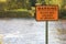 Warning River Bed Hazard at Bridge Sign