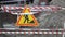 Warning roadworks sign and safety barrier on city street during maintenance repair work