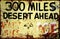 Warning sign `300 miles desert ahead`