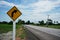 A warning sign curves to guide the road to prevent danger