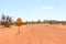 Warning sign for dry weather road only, unsealed traveling in the Australian Outback