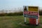 Warning sign on east coast, UK, cliff top for danger of erosion.