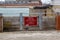 A warning sign on flood gates that reads Danger strong tides and heavy wash from passing vessels it is dangerous to swim in this