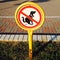 A warning sign forbidden to let dogs poop here