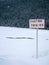 Warning sign at frozen Lake Louise