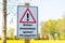 Warning sign with german text, eichenprozessionsspinner! Allergiegefahr!, in english oak procession spinner allergy hazard