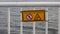 Warning sign with graphic icons on metal railings on ships sying Don`t lean over board