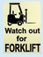 A warning sign informing people to care because forklift trucks are in operation in the area