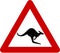 Warning sign with kangaroos on road