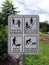 A warning sign with multiple messages for cyclist and dogs