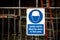 The warning sign requiring to wear hard hat in order to improve safety and save lives