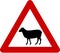 Warning sign with sheeps on road