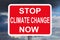 Warning sign STOP CLIMATE CHANGE NOW
