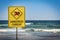 Warning sign for swimmers to beware dangerous currents