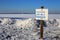 Warning sign of THIN ICE at lakeside