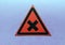 Warning sign two intersecting lines in a red triangle on a blue background