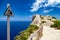 Warning sign at vantage point with view Mirador Es Colomer on punta nau at cap formentor majorca mallorca. Balearic islands