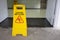 Warning sign for wet floor in the public toilet