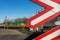 Warning signs at railway crossing with the train