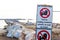 Warning signs on the shoreline in Follonica, Italy